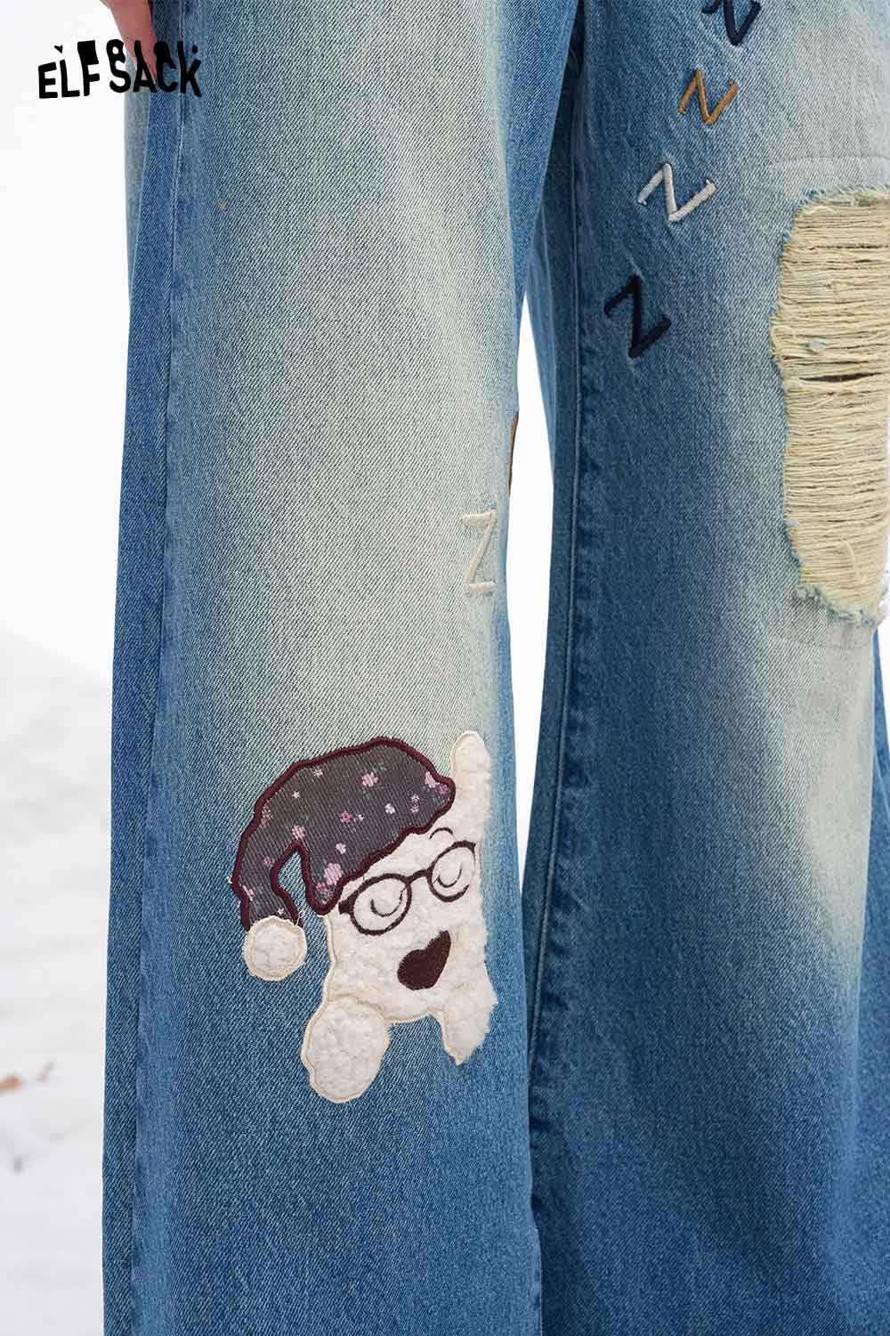 ELFSACK dog graphic distressed jeans featuring playful embroidery and a trendy relaxed fit