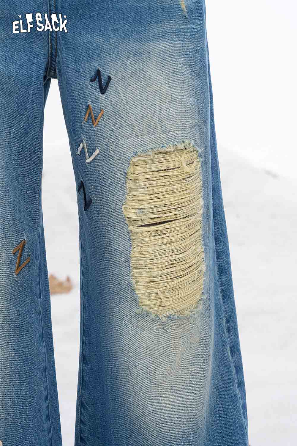 ELFSACK dog graphic distressed jeans with unique patchwork and a relaxed fit for casual style