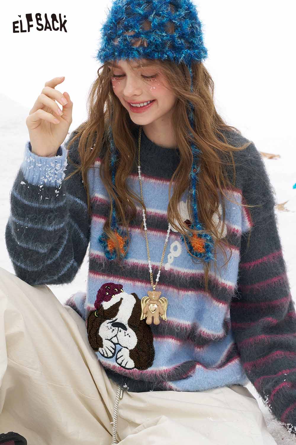 ELFSACK dog graphic sweater for women featuring a colorful striped design and playful dog illustrations