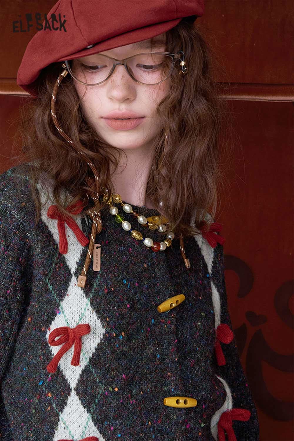 ELFSACK double breasted bow sweater in colorful specks featuring decorative buttons and bows