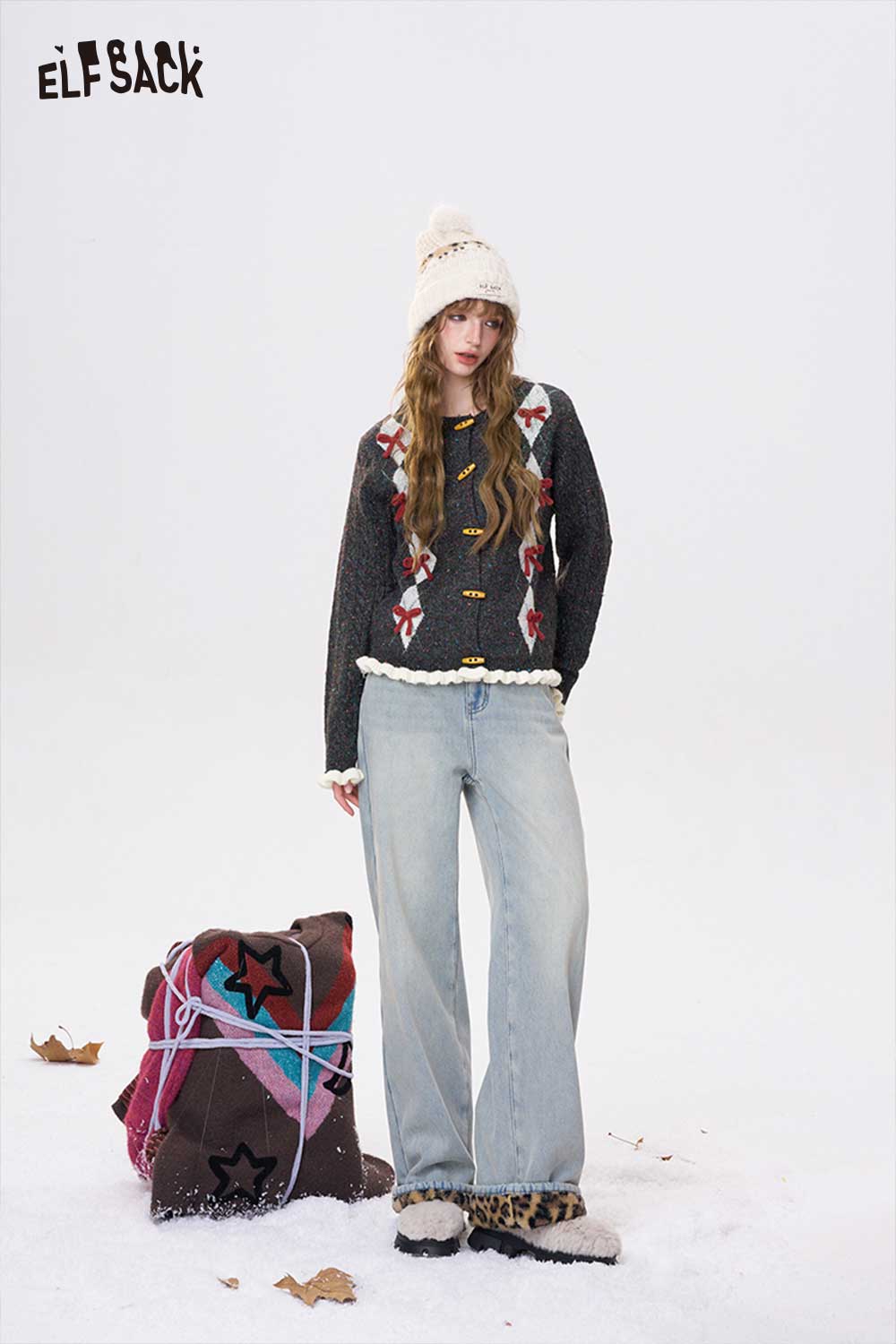 ELFSACK double breasted bow sweater in dark colors, styled with wide-leg jeans and a winter hat