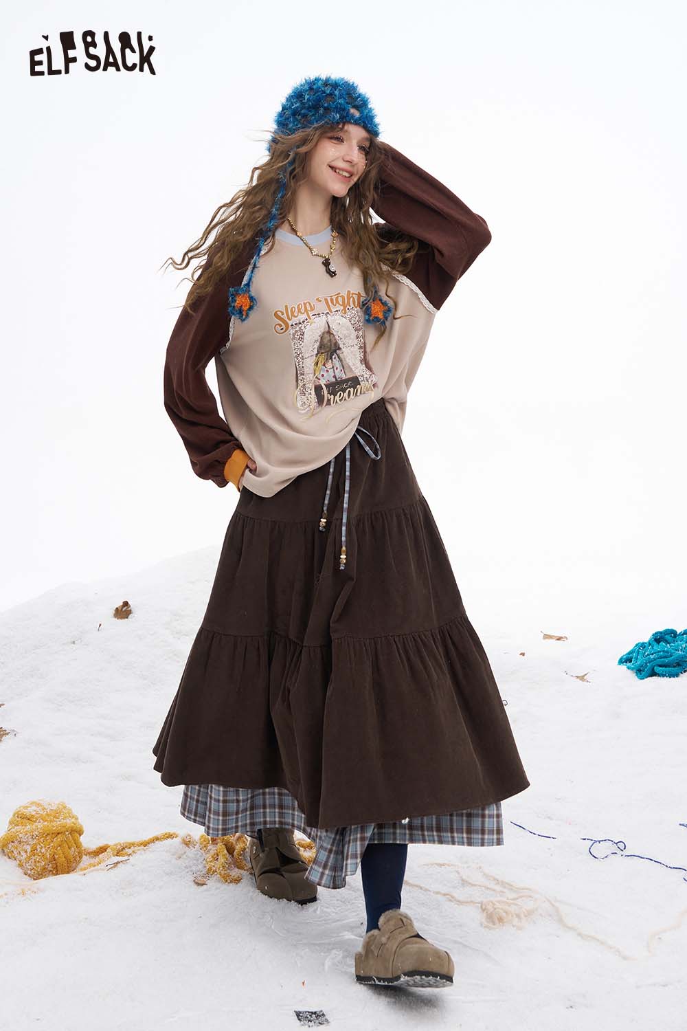 ELFSACK double layer long skirt for women, styled with a cozy top and accessories, perfect for a casual look.