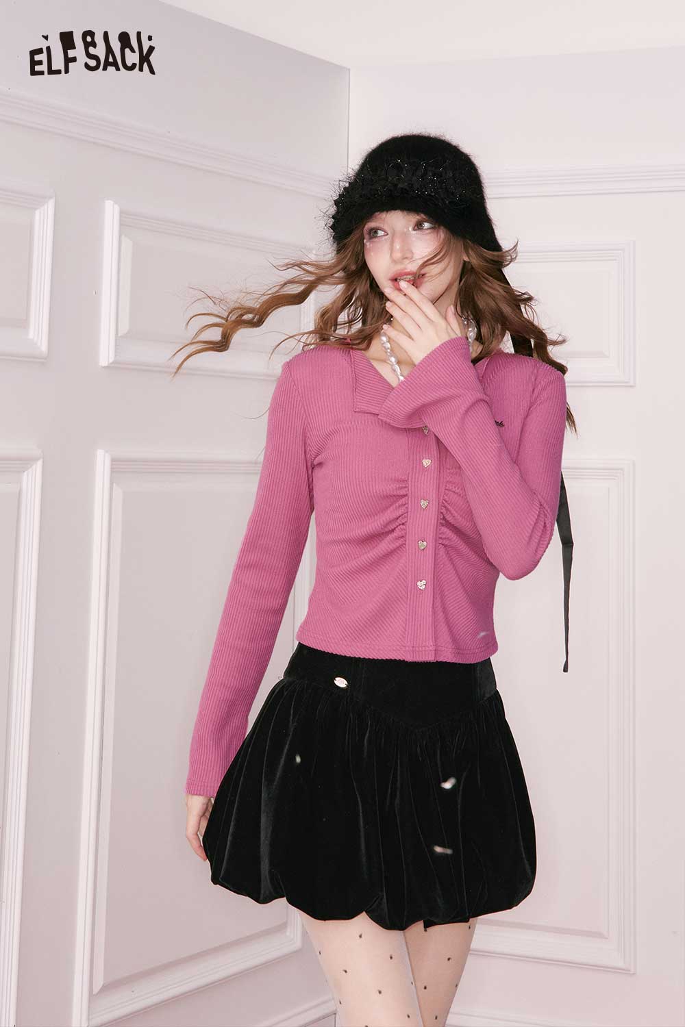 ELFSACK shirred knit cardigan for women in pink paired with a black skirt for a stylish look