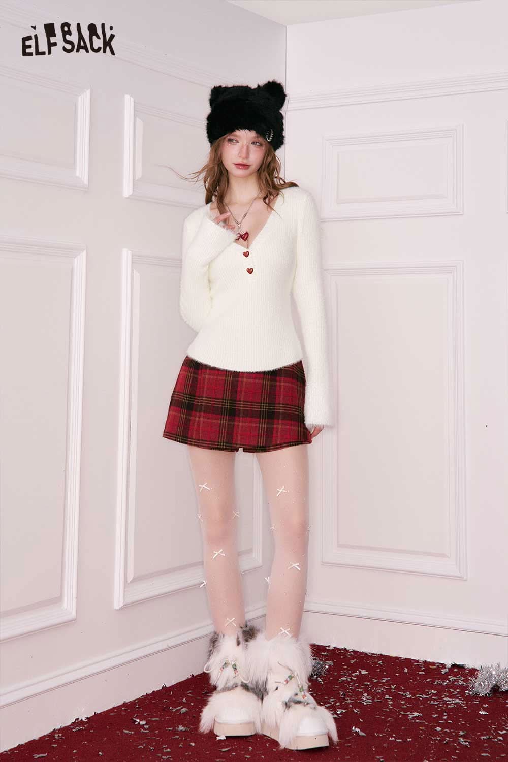 Elegant v neck sweater women in cream paired with a plaid skirt and winter accessories