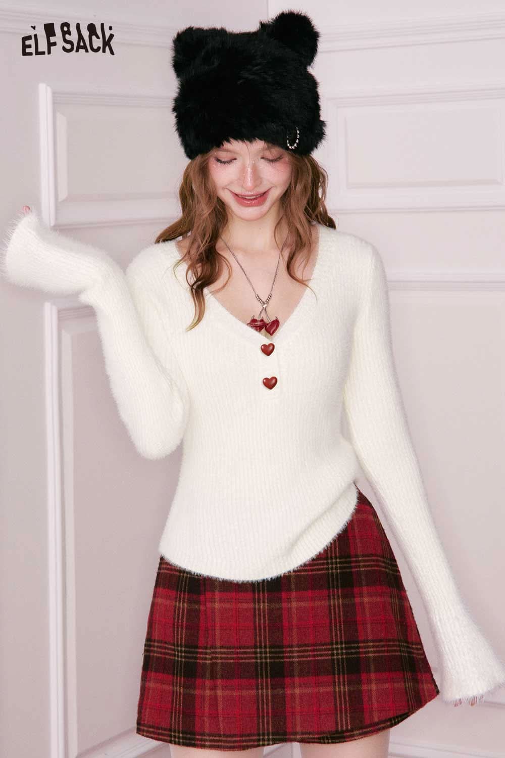 ELFSACK elegant v neck sweater women in white with heart buttons, paired with a plaid skirt