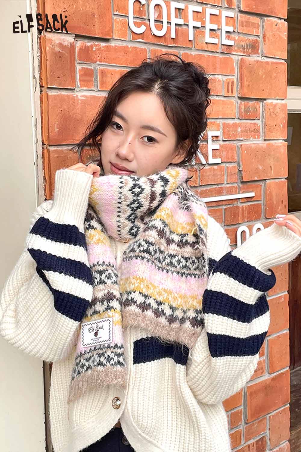 ELFSACK Bohemian Stripe Neck Warmer in soft pastel colors, perfect for a cozy winter look