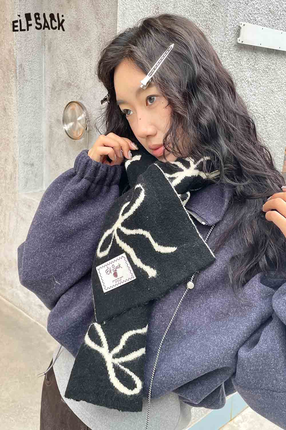 ELFSACK bow graphic neck warmer in black with a stylish bow pattern for added warmth