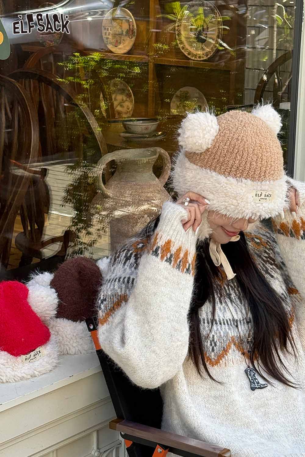 ELFSACK cute plush ear flap hat in cozy setting, featuring playful bear ears and soft texture
