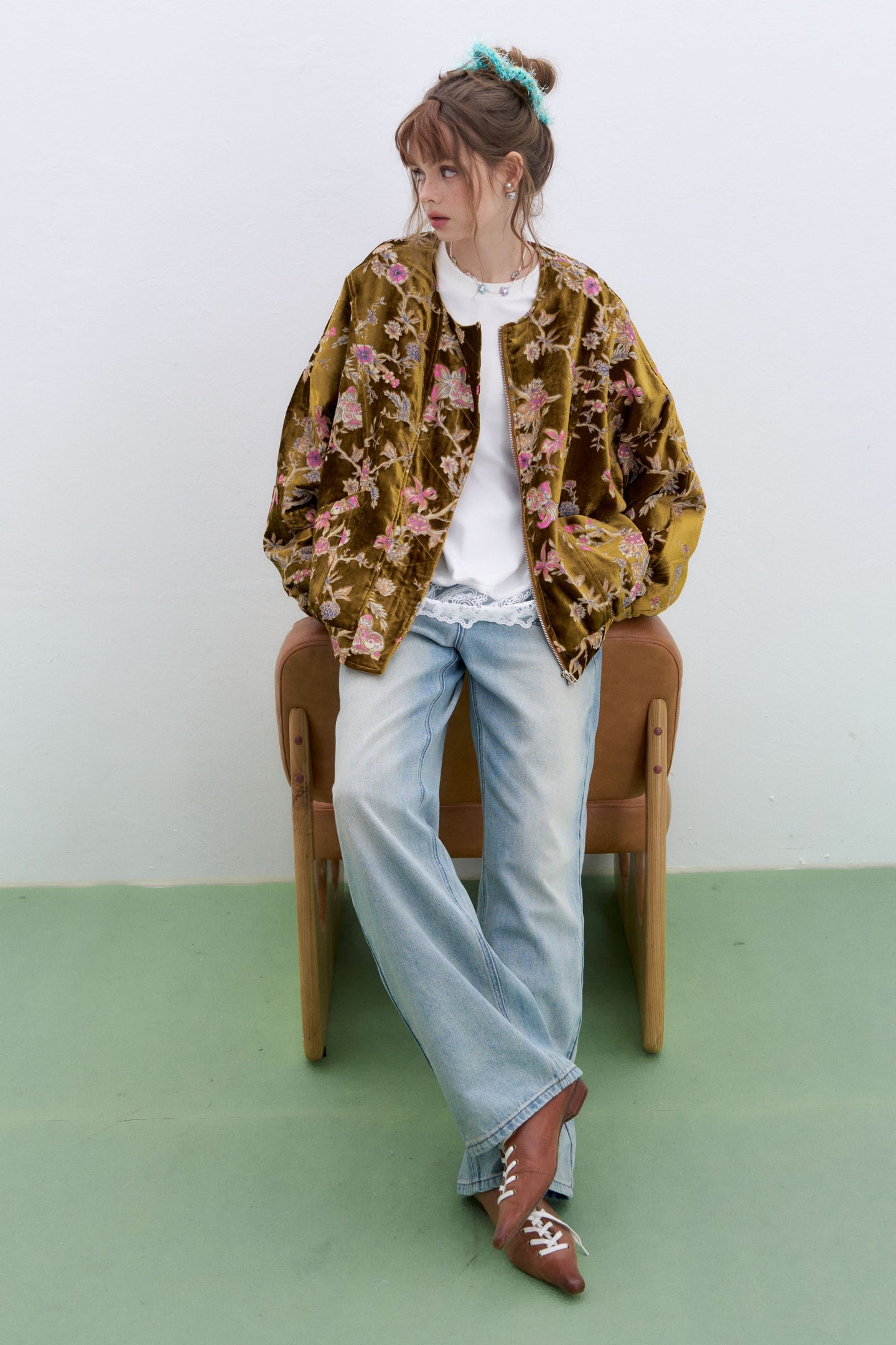 Plus size floral velvet bomber jacket by ELFSACK worn with a white top and relaxed jeans