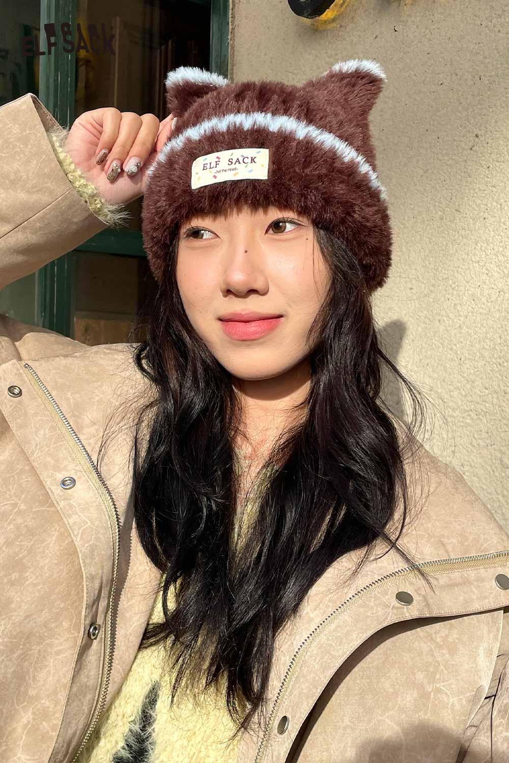 Cozy brown plush cat ear hat for women by ELFSACK, featuring playful design and soft fabric