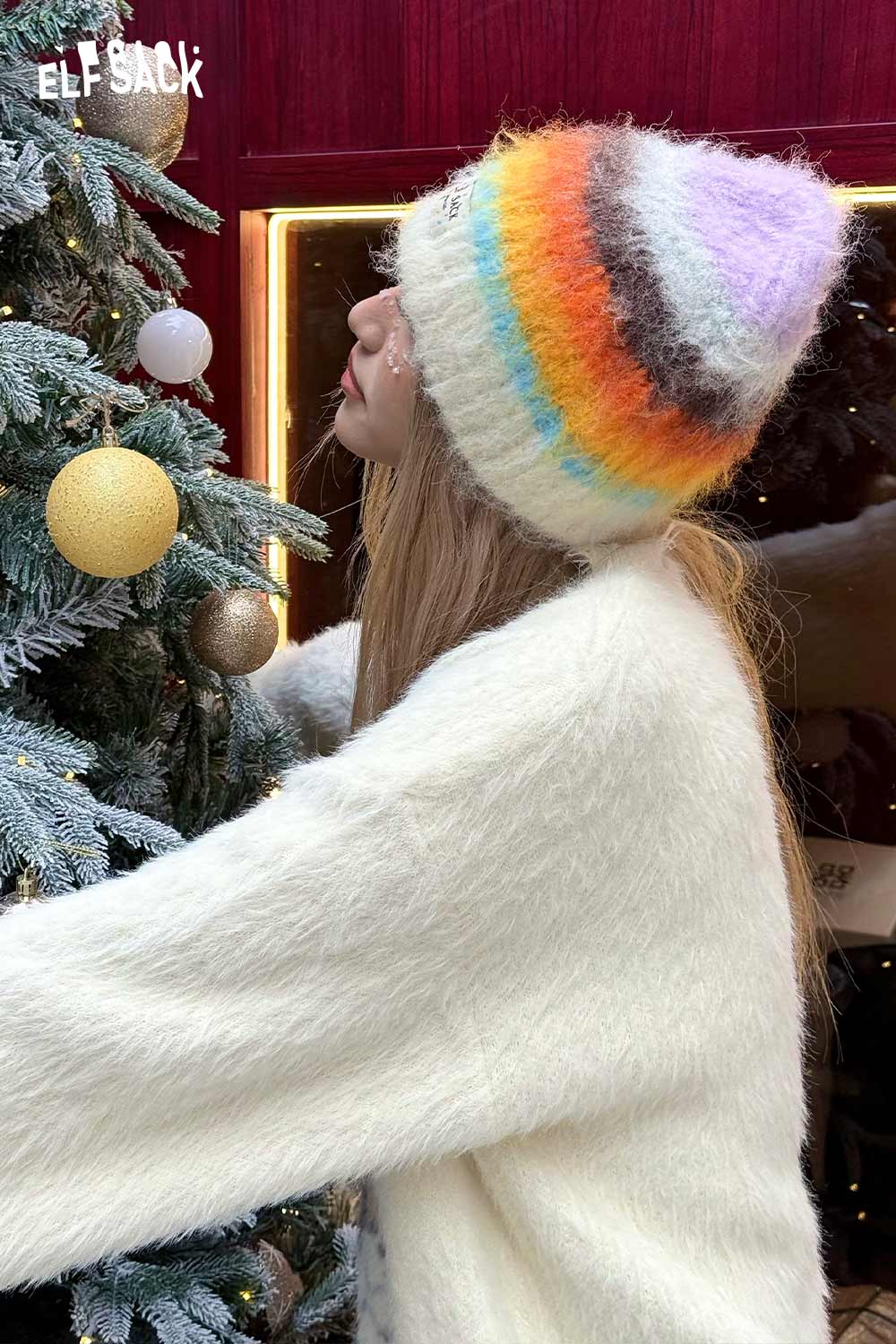 Stylish rainbow striped knit beanie for a cozy winter look, perfect for cold weather fashion