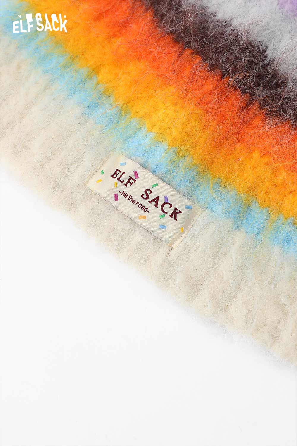 Rainbow striped knit beanie by ELFSACK featuring colorful stripes and a soft texture