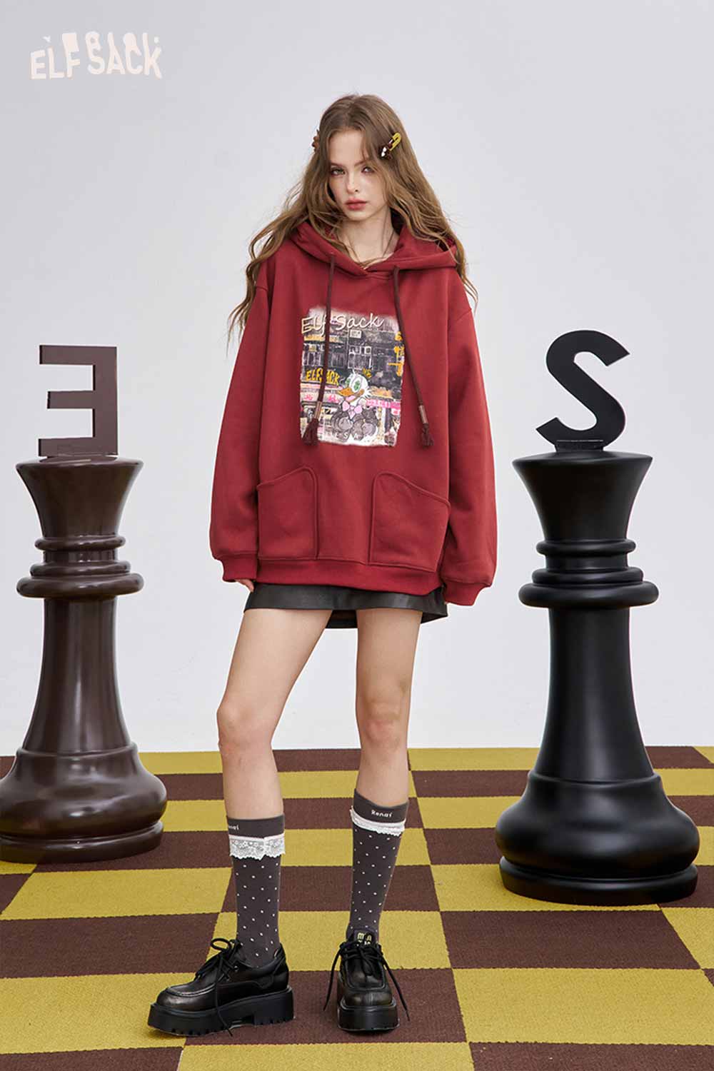 ELFSACK soft graphic hooded sweatshirt in red with a front pocket and oversized fit for casual style