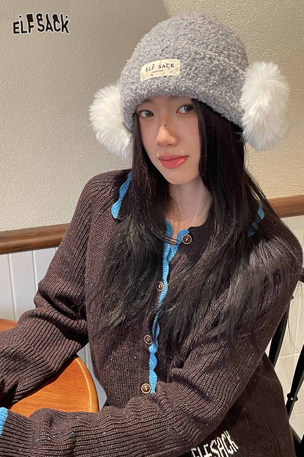 ELFSACK gray beanie with white plush ear muffs, perfect for winter style and warmth.