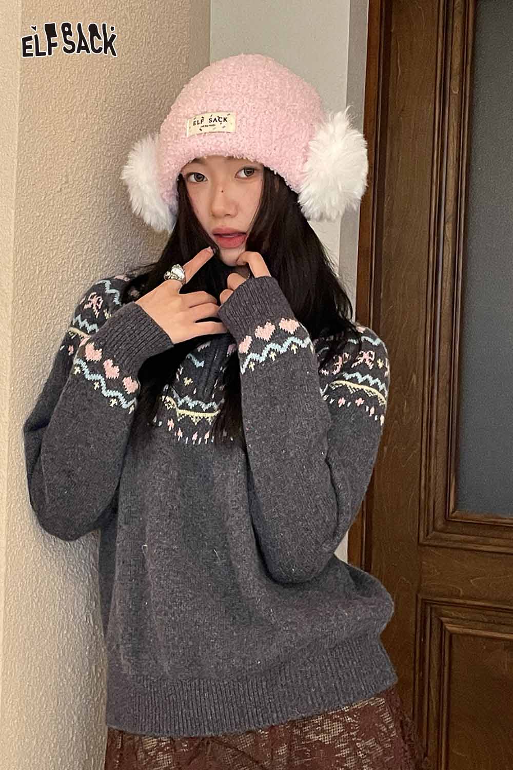 ELFSACK pink white plush ear muff beanie paired with a cozy gray sweater for winter style