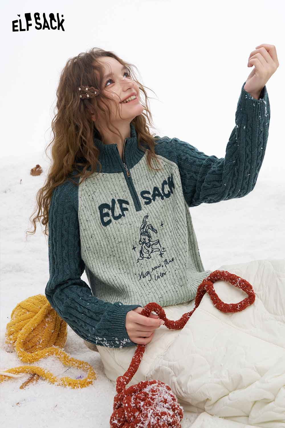 ELFSACK women's graphic color block knitwear featuring a zip-up design and playful illustrations