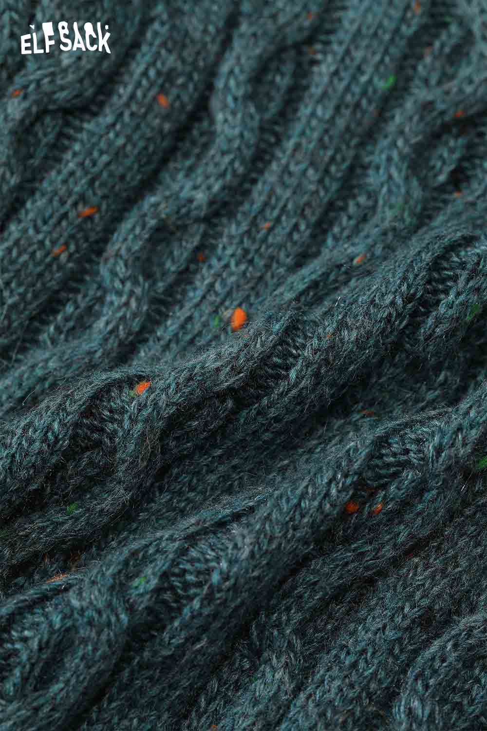 Close-up of ELFSACK women's graphic color block knitwear featuring a textured cable design