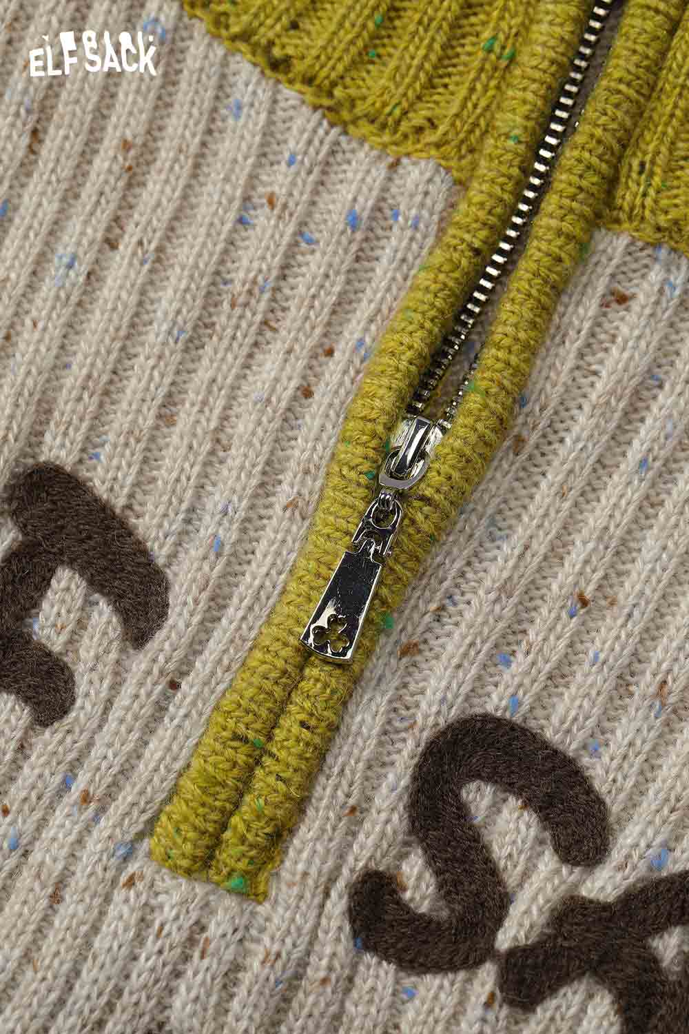 Close-up of ELFSACK women's graphic color block knitwear featuring a stylish zip closure