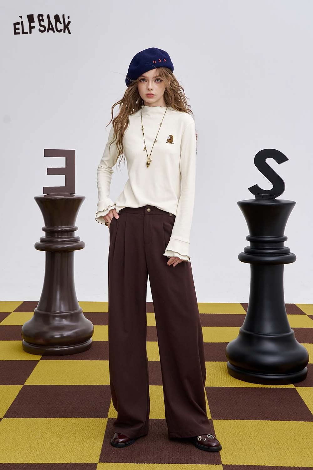 ELFSACK animal embroidered long sleeve tshirt in cream color paired with stylish pants