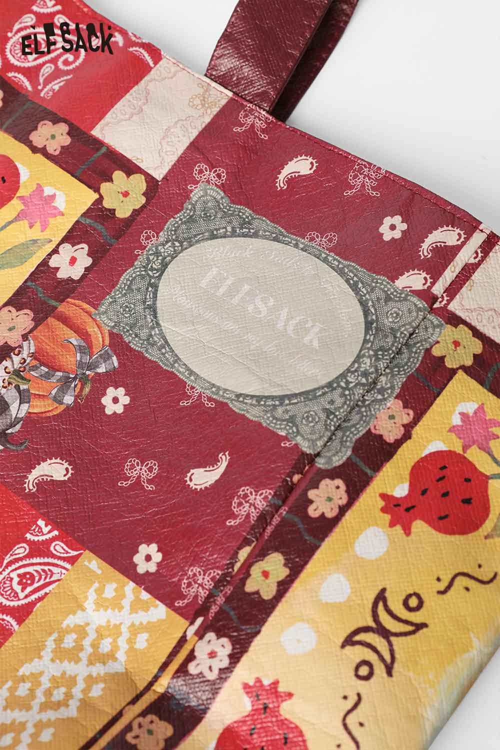 ELFSACK Bohemian rabbit print shoulder bag with colorful patchwork design and decorative label.