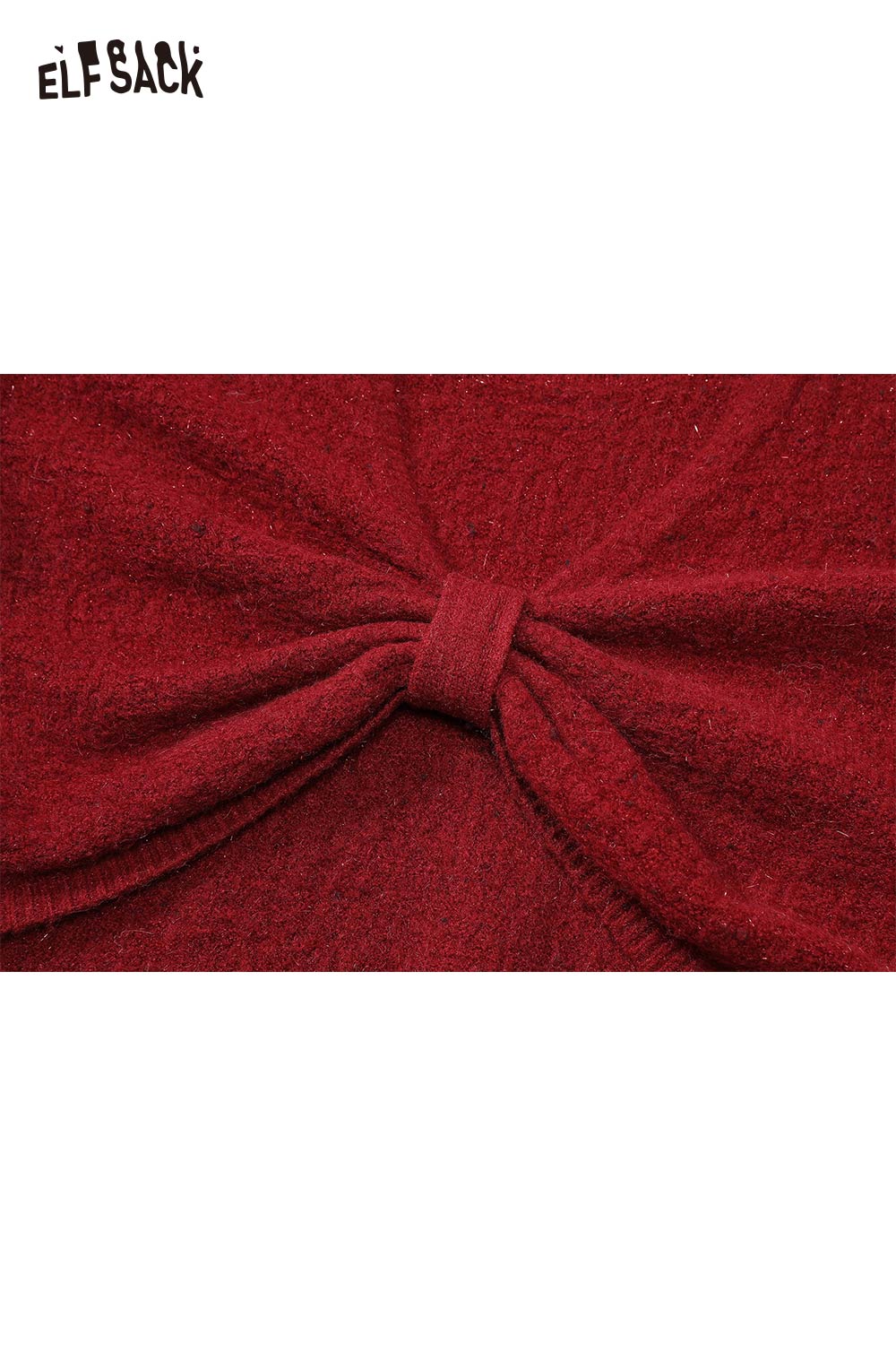 Close-up of ELFSACK bow embellished cutout sweater in textured red fabric showcasing the bow detail