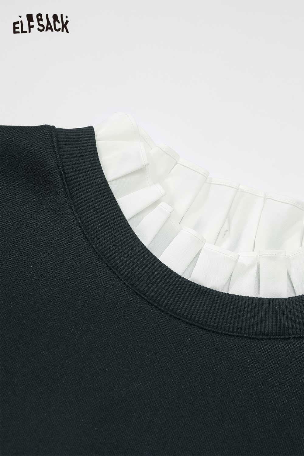 Close-up of the ruffled neckline on the ELFSACK cherry embroidery dress in black