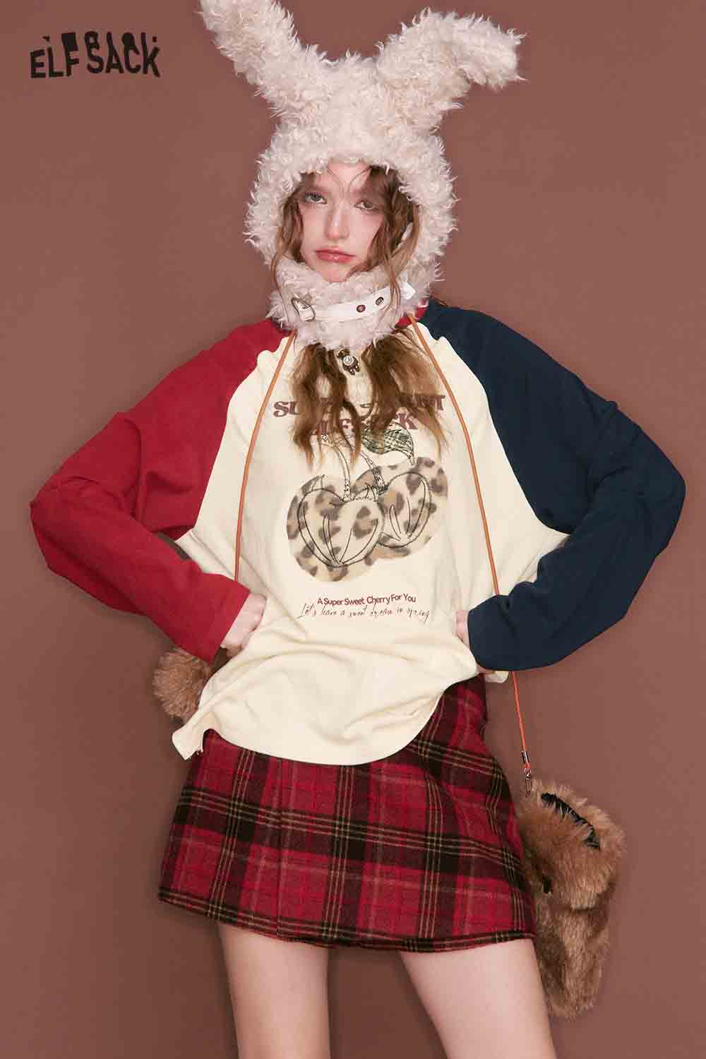 ELFSACK color block raglan sleeve tshirt featuring playful graphics and bold colors on a relaxed fit