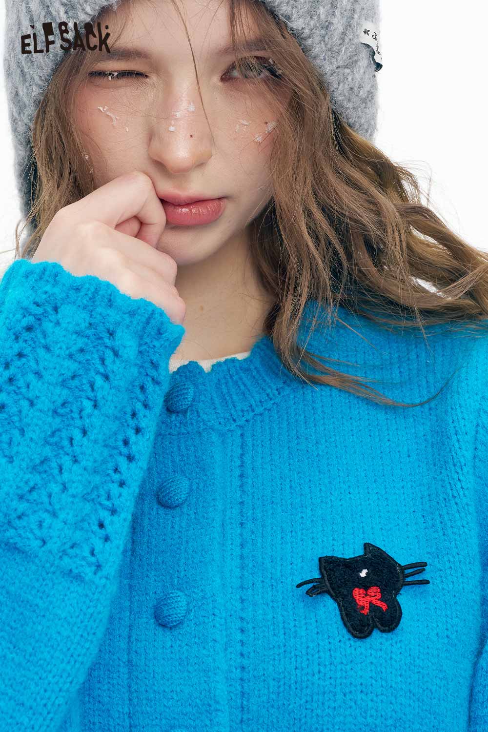 Cute knit embroidered sweater for women by ELFSACK with a playful cat design in vibrant blue