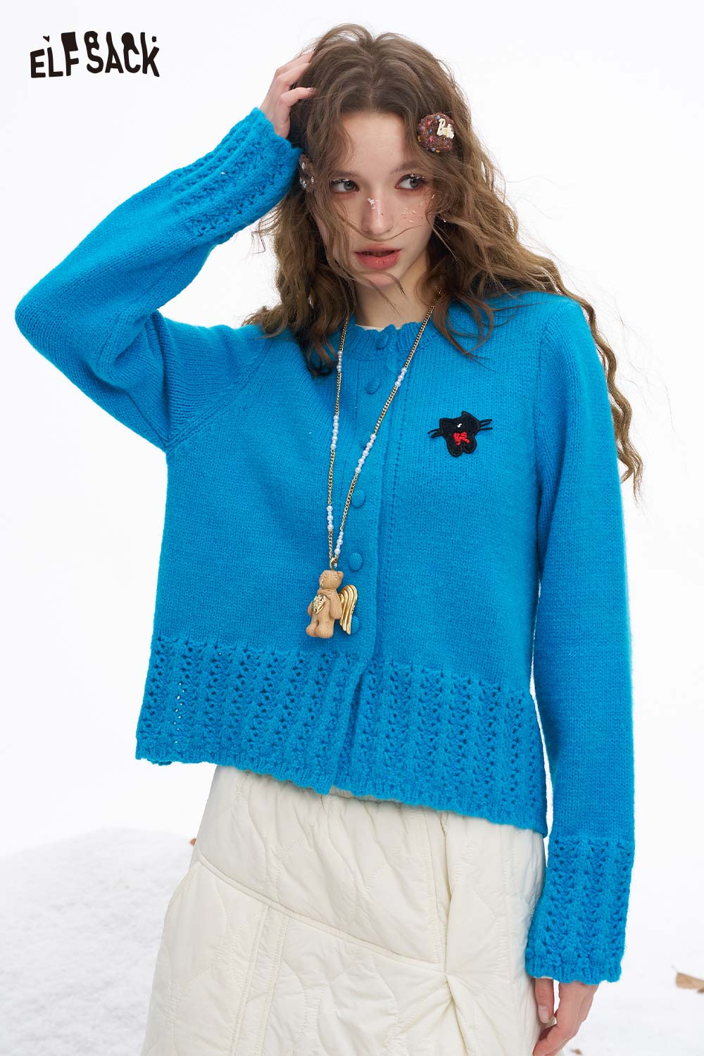 Cute knit embroidered sweater for women in vibrant blue with unique pattern and buttons