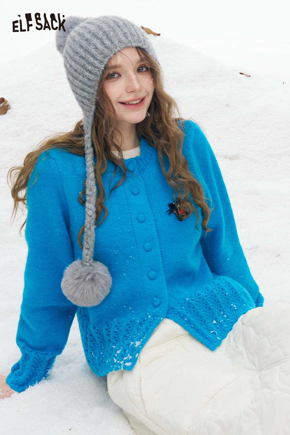 Cute knit embroidered sweater for women in vibrant blue with a playful design, perfect for winter outings