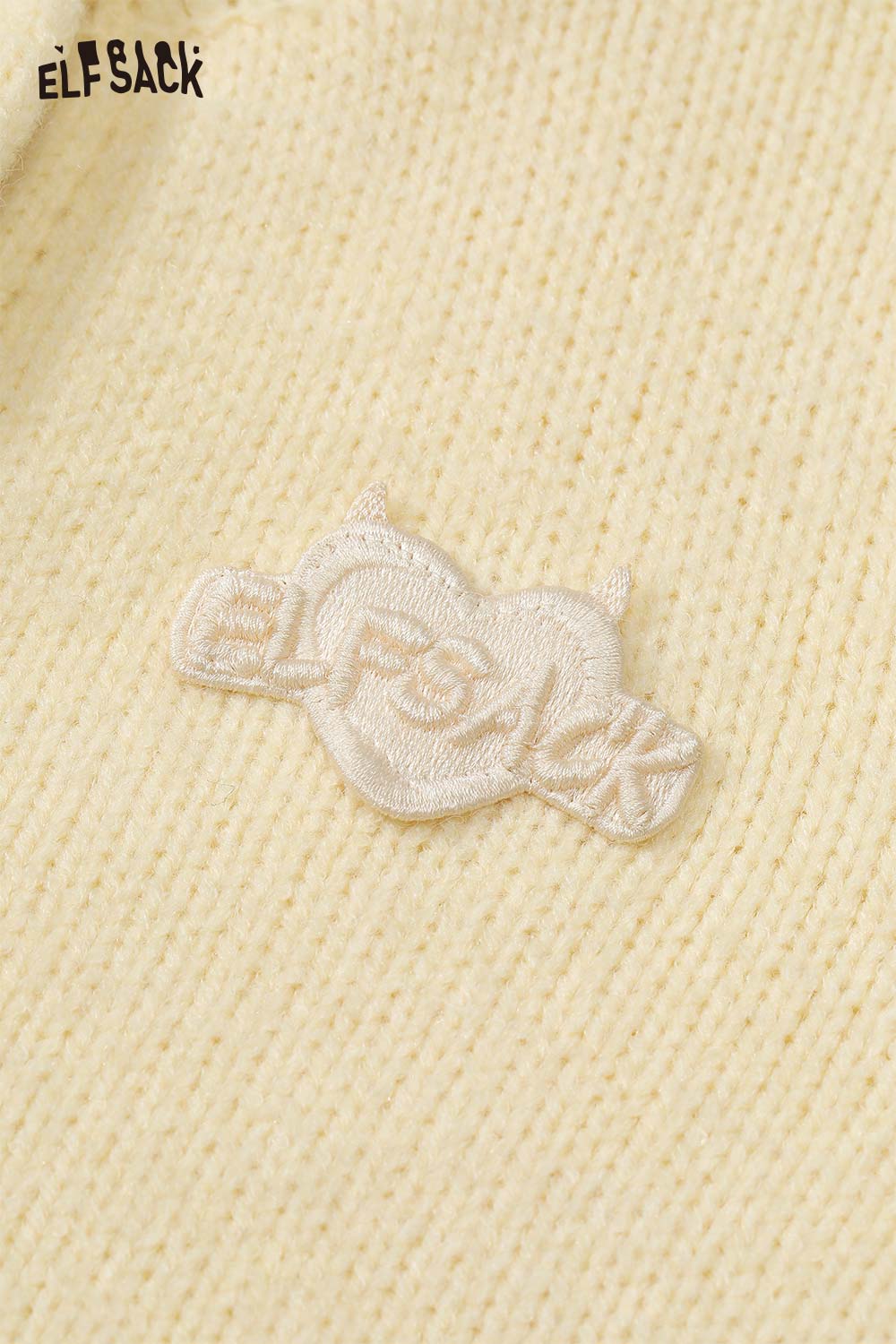 ELFSACK cute knit embroidered sweater for women in soft yellow with unique logo detailing