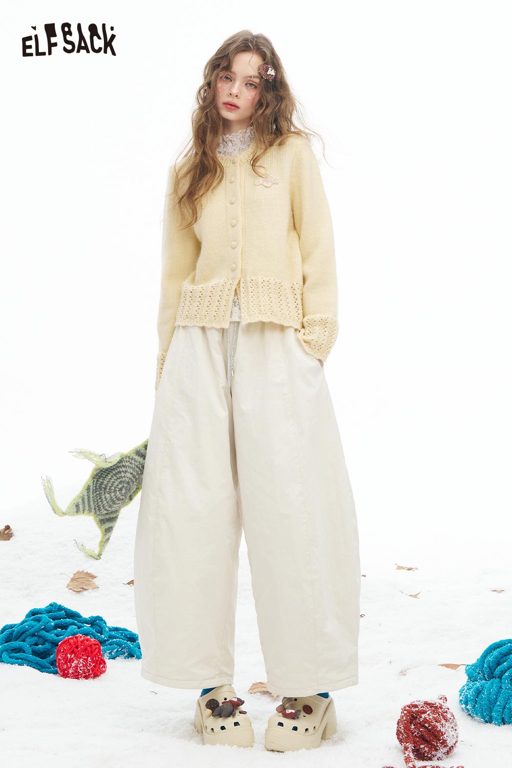 Cute knit embroidered sweater for women by ELFSACK paired with oversized pants for a trendy outfit