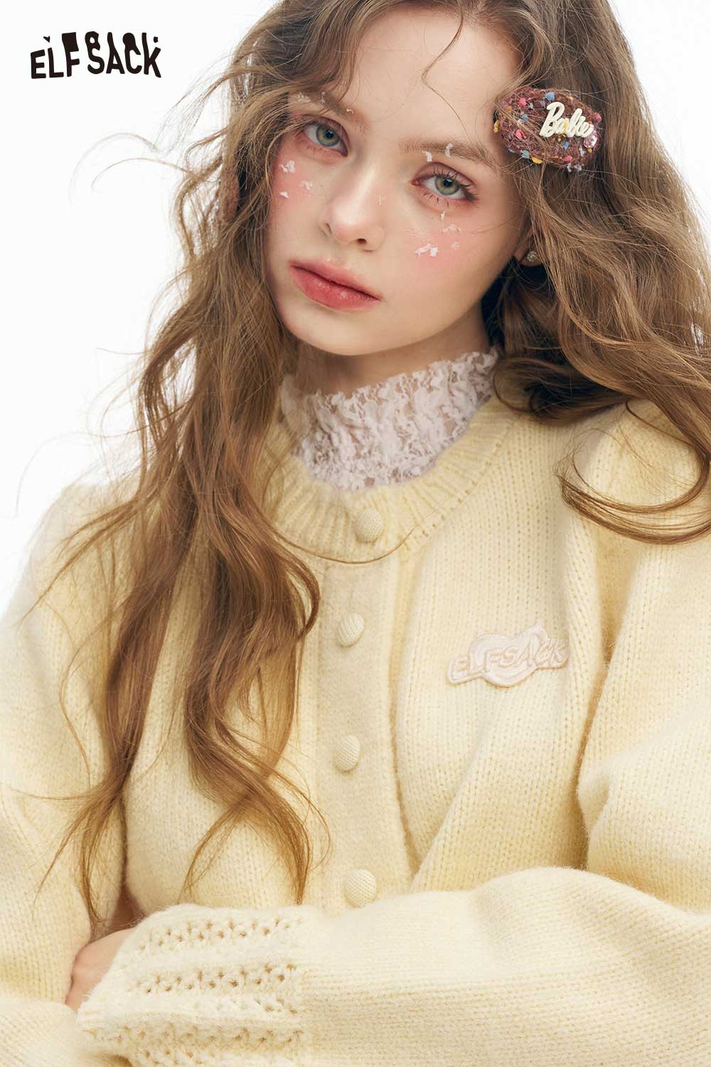 Cute knit embroidered sweater for women in soft yellow with decorative button details and lace trim