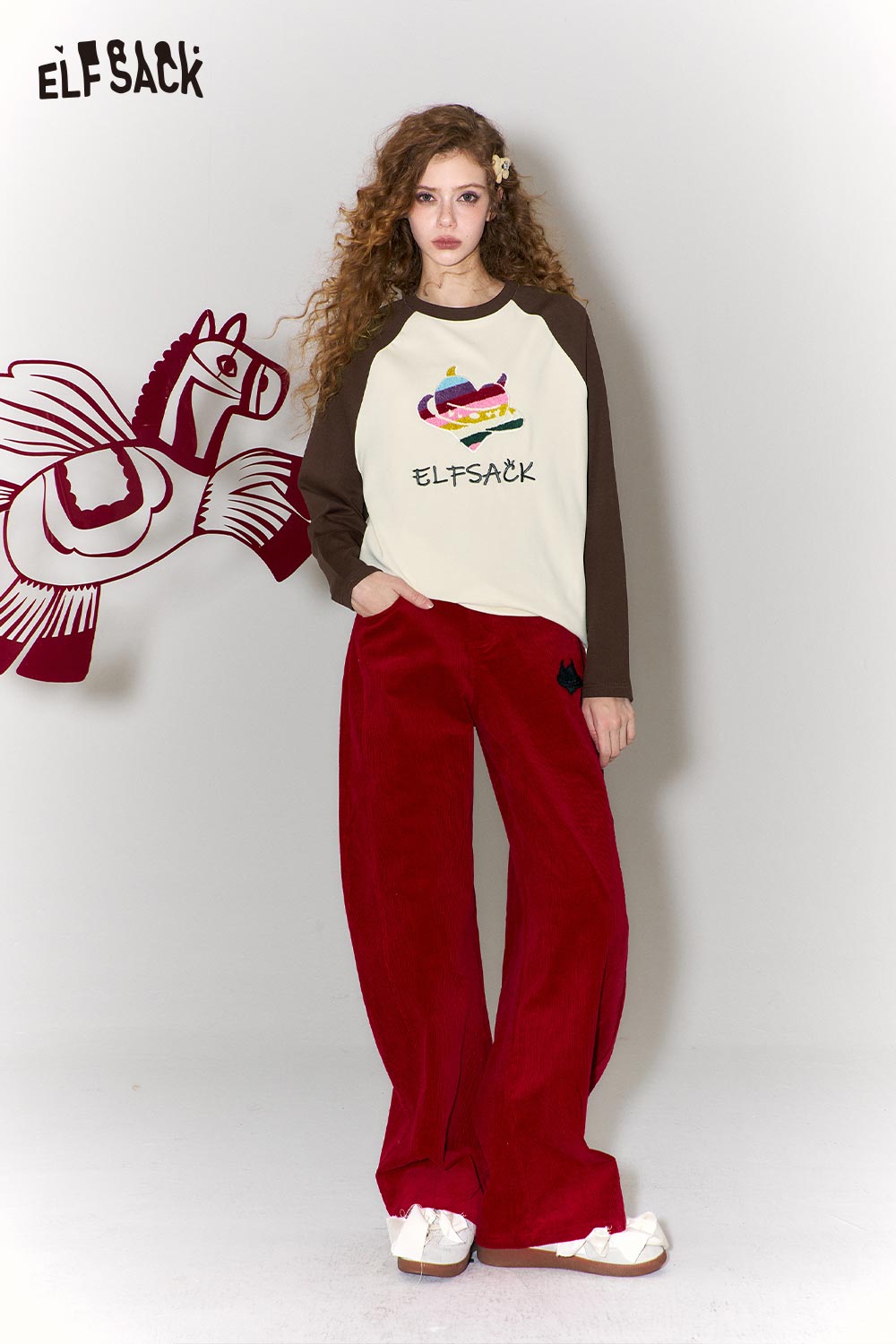 ELFSACK devil heart embroidery t-shirt in cream with brown sleeves and playful design