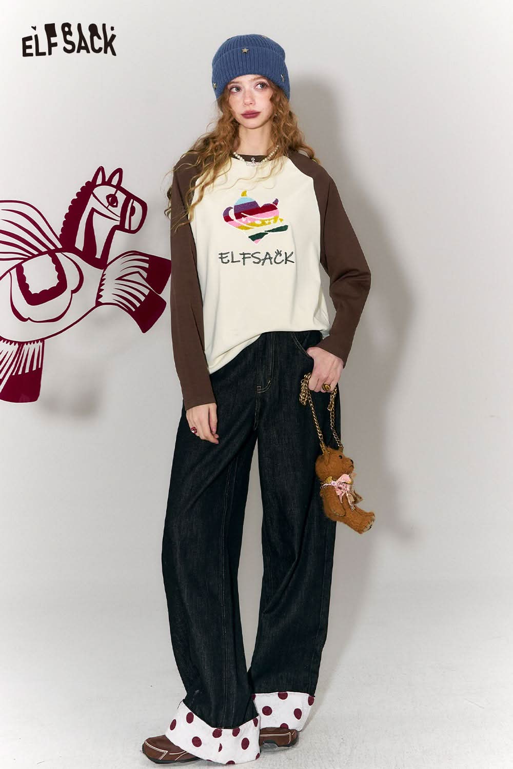 ELFSACK devil heart embroidery t-shirt in cream with brown sleeves, styled with casual wide-leg jeans