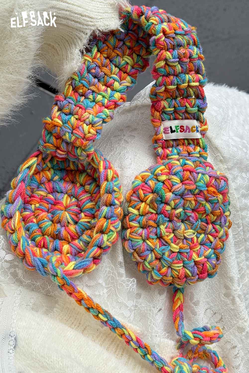 Colorful ELFSACK hand-knitted ear warmers with vibrant yarn for winter warmth and style