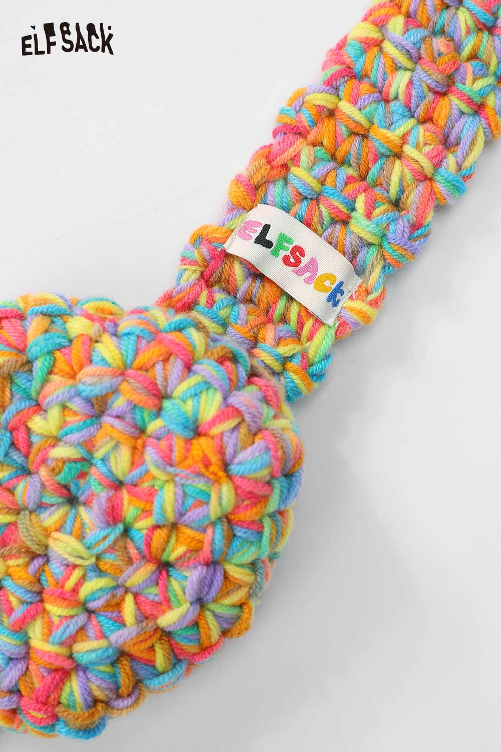 Colorful ELFSACK hand-knitted ear warmers featuring a vibrant braided design for cozy winter wear