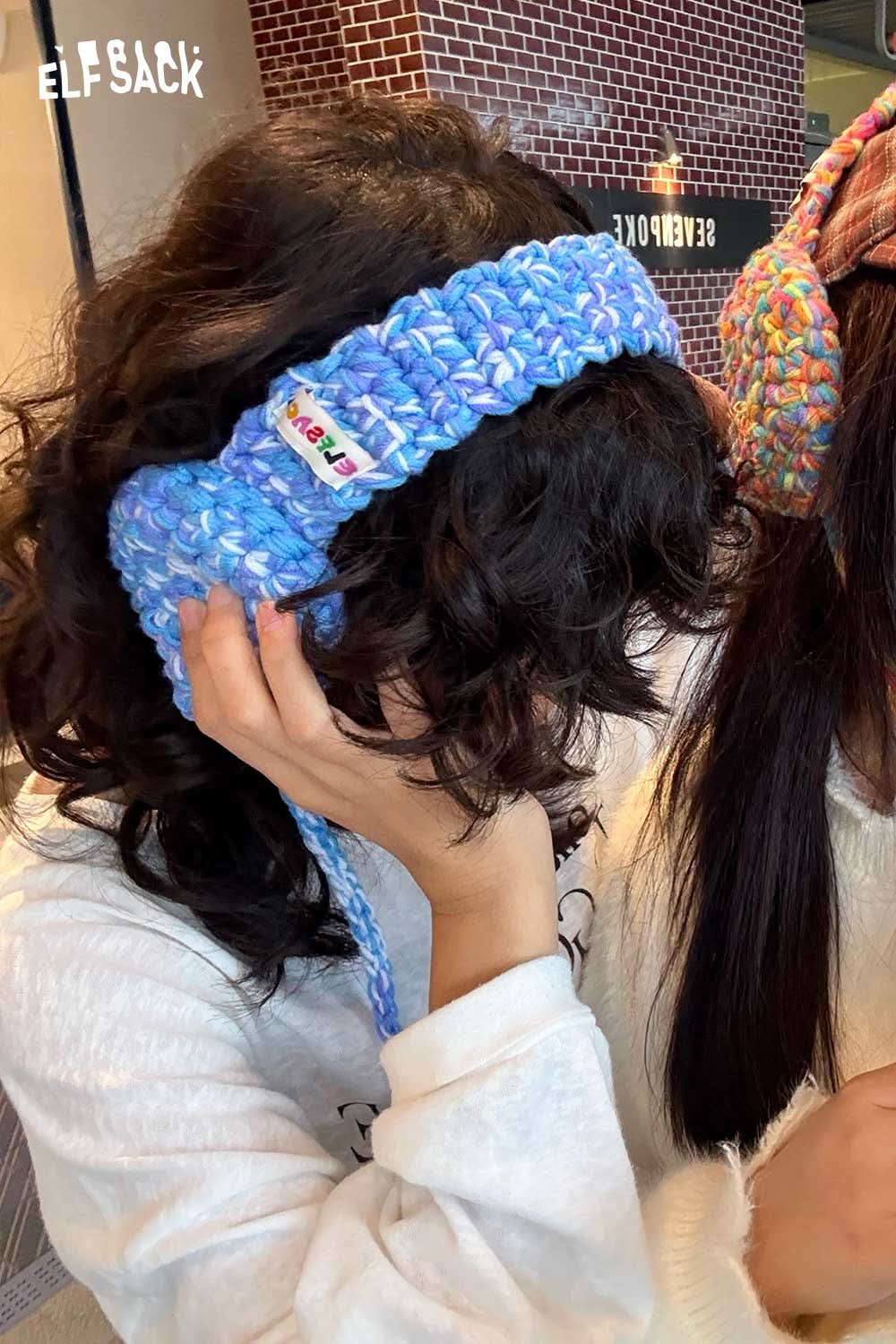 ELFSACK hand-knitted ear warmers in blue providing stylish warmth for colder days