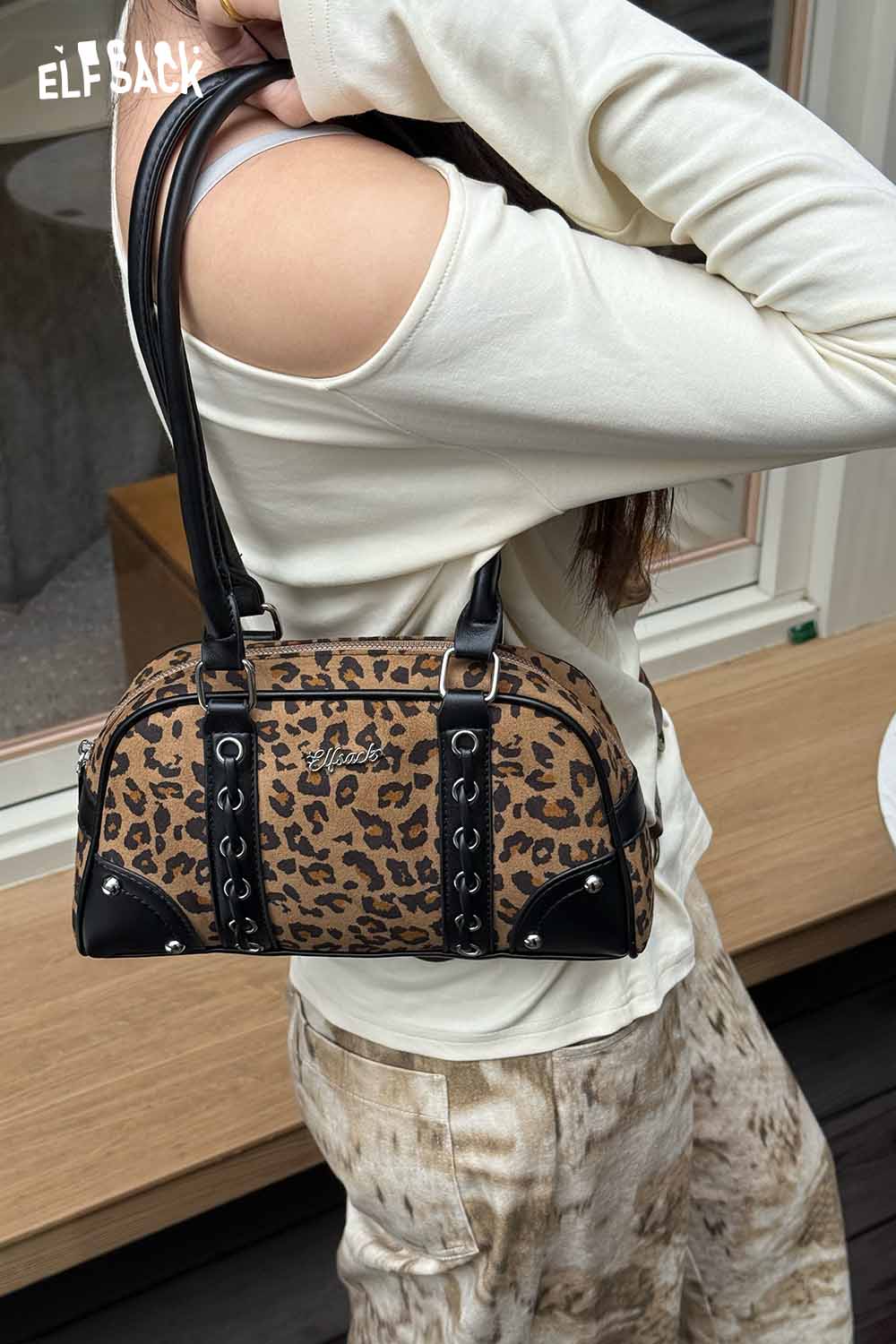 Stylish ELFSACK leopard print crossbody bag with a trendy design and black accents