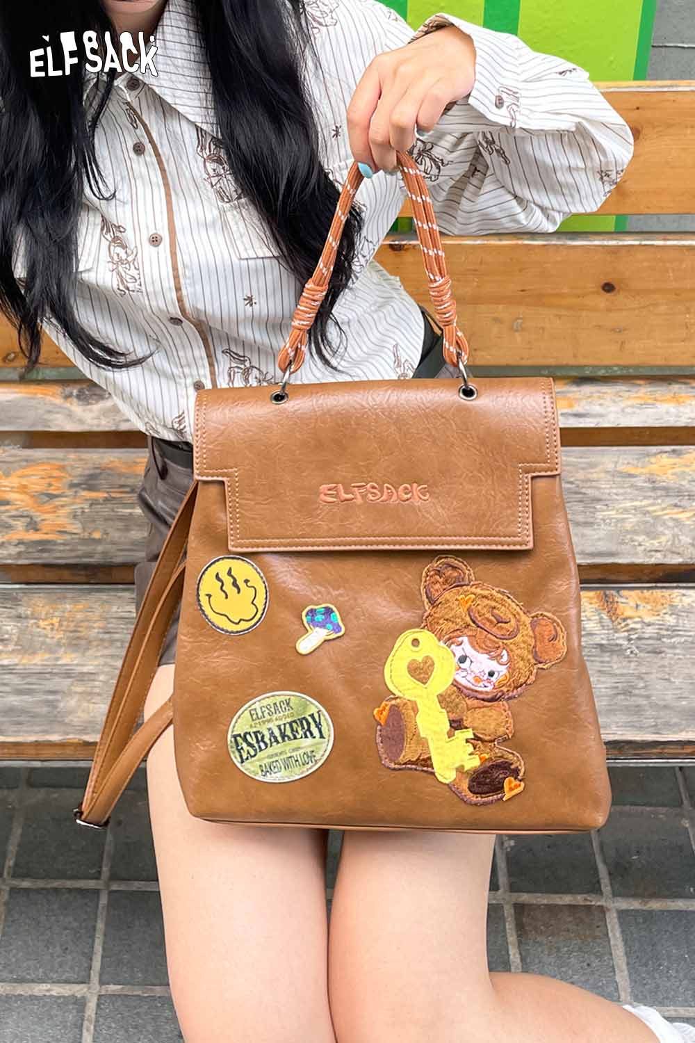 ELFSACK playful embroidery PU leather backpack with colorful patches and a cute bear design