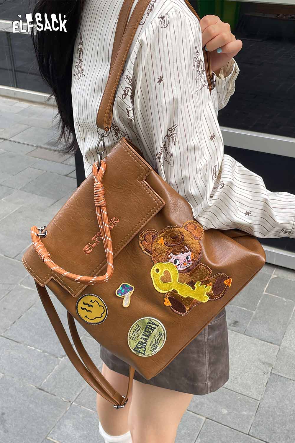 ELFSACK playful embroidery PU leather backpack with fun patches and adjustable strap