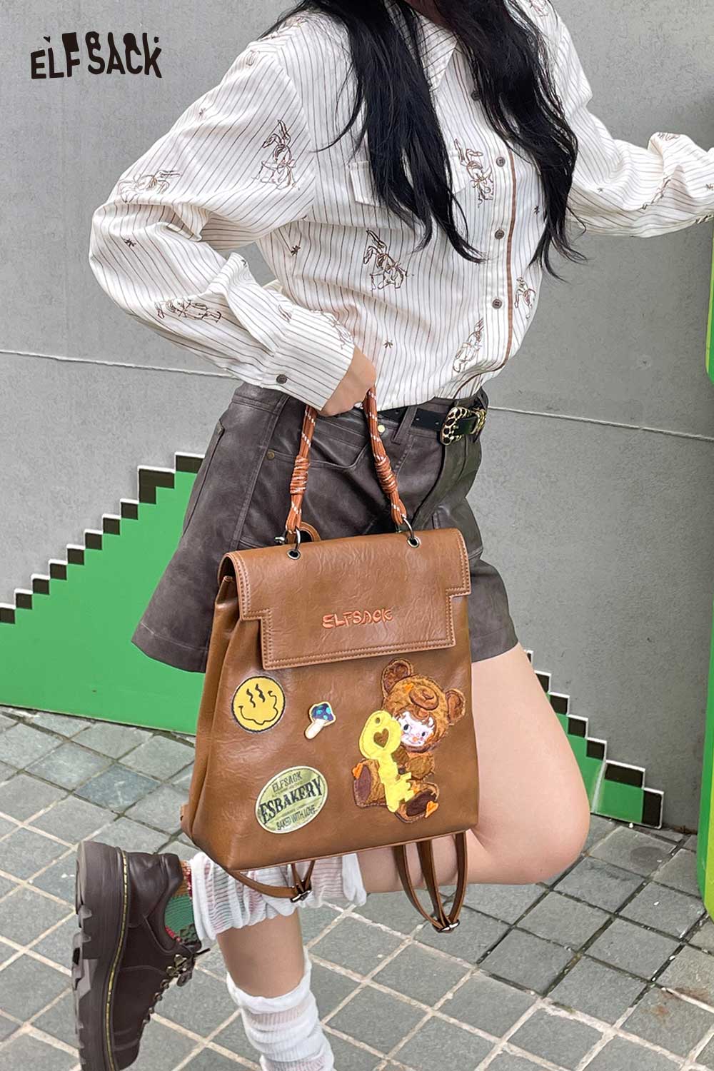 ELFSACK playful embroidery PU leather backpack in brown with fun patches for stylish storage