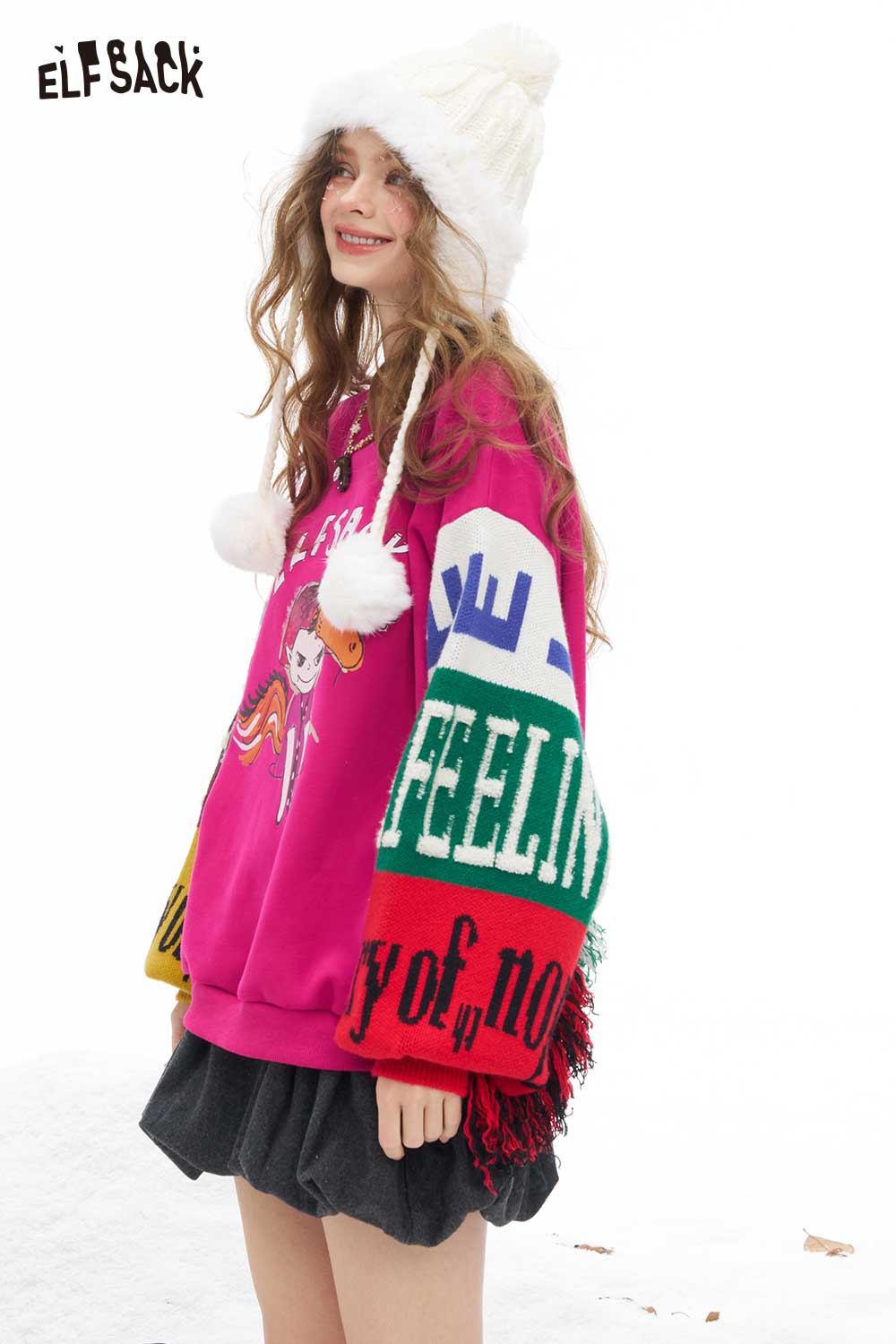 Colorful women's graphic patchwork sweatshirt by ELFSACK with playful designs and cozy fit