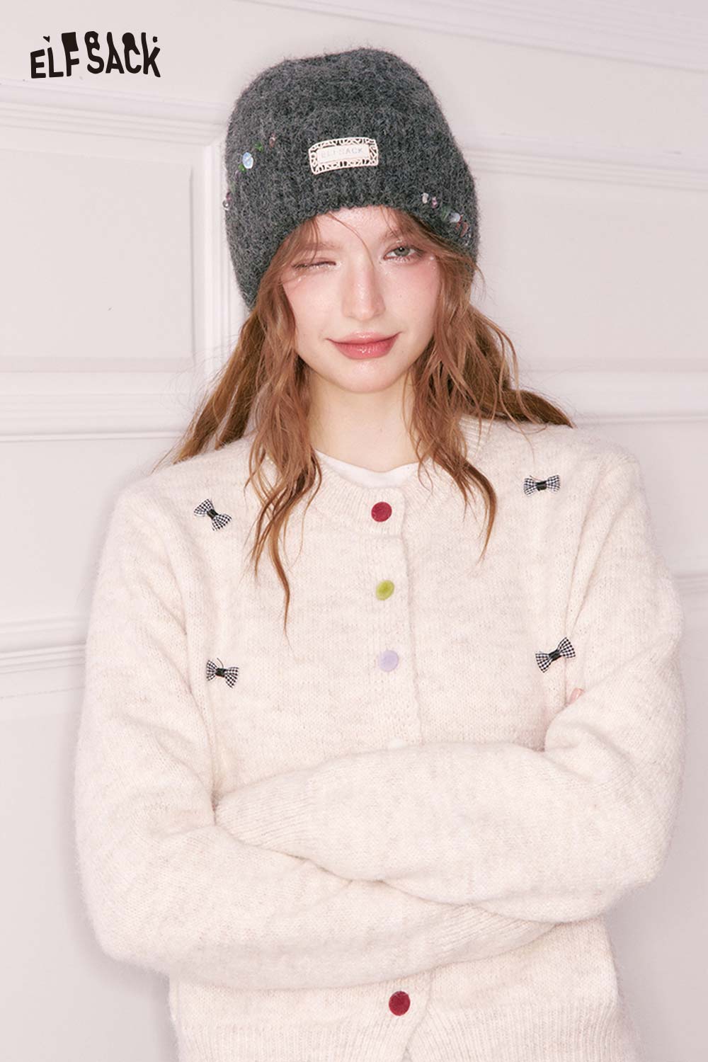 ELFSACK women's solid color beanie paired with a cozy cardigan for a stylish winter look