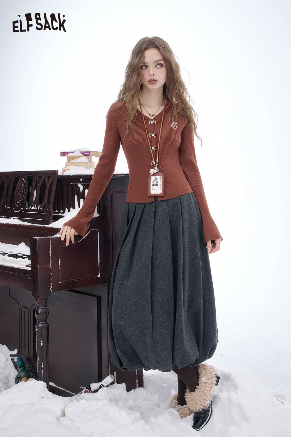 Stylish ELFSACK embroidered knit V neck sweater paired with a full maxi skirt for a chic look