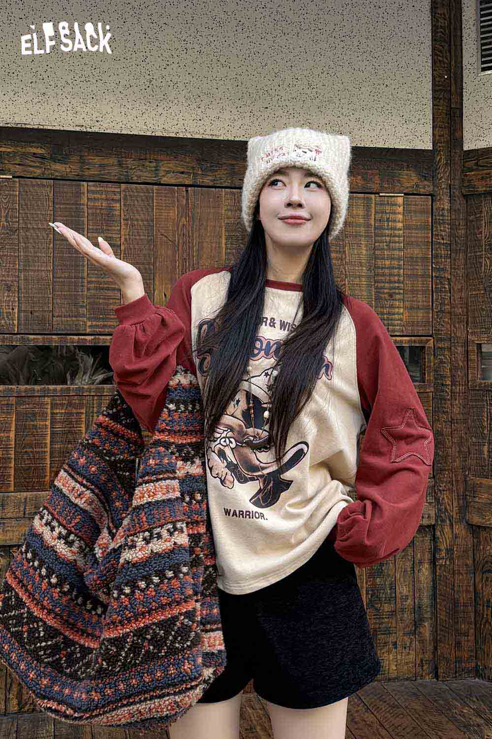 ELFSACK Fair Isle tote bag styled with a casual outfit featuring a graphic sweater and knit hat