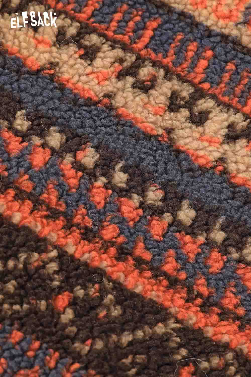 Close-up of vibrant patterns on ELFSACK Fair Isle tote bag in warm colors
