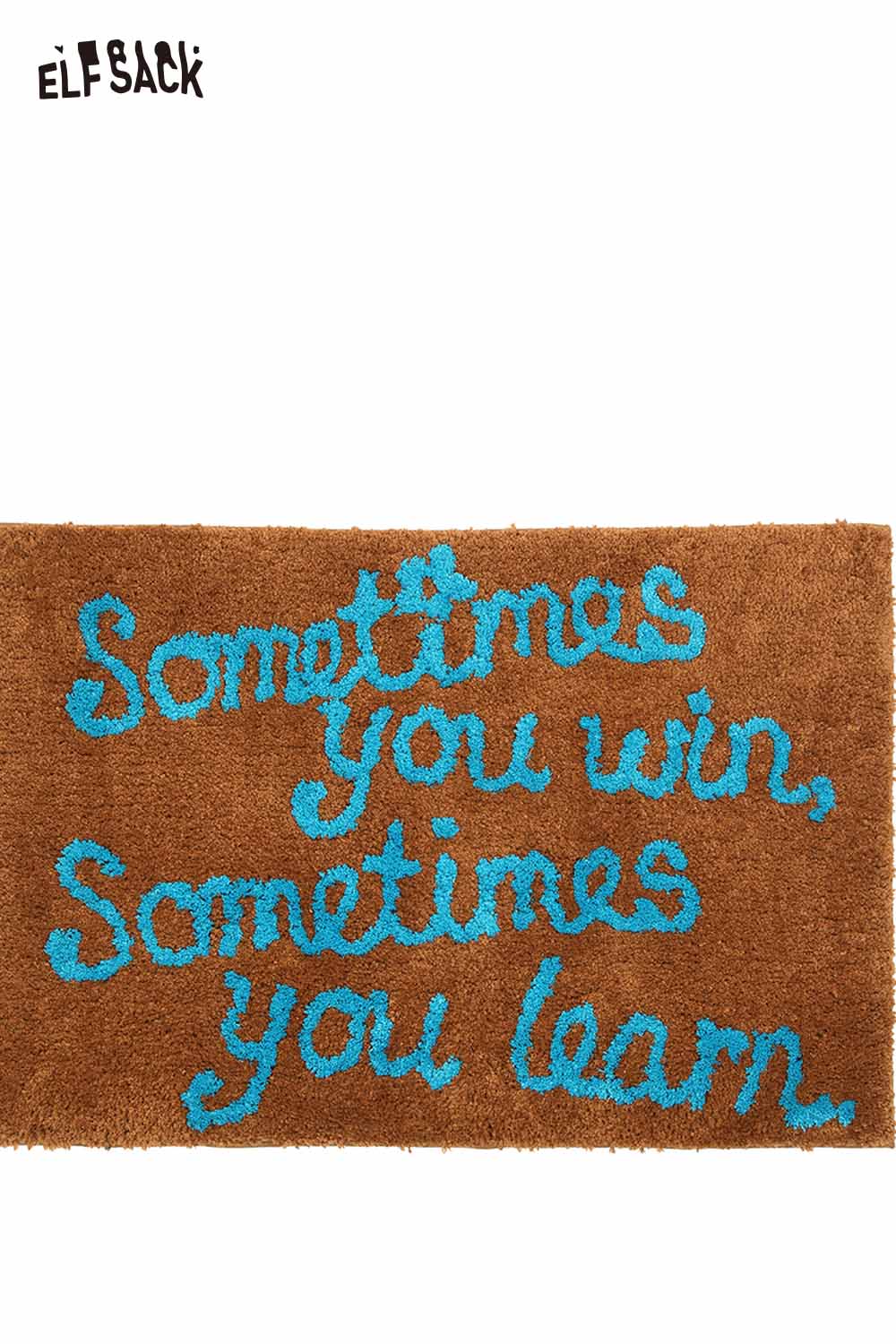 Felted wool rug with typography in brown featuring the phrase sometimes you win sometimes you learn