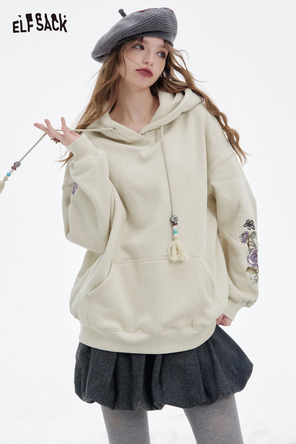 ELFSACK floral graphic tassel hoodie for women with oversized fit and decorative flowers