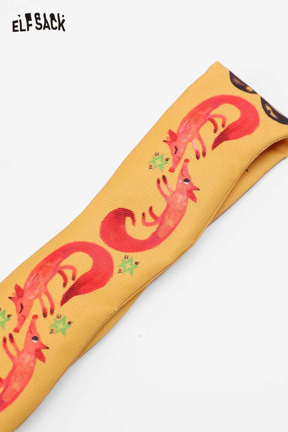 ELFSACK fox character phone strap in bright yellow with playful red fox designs